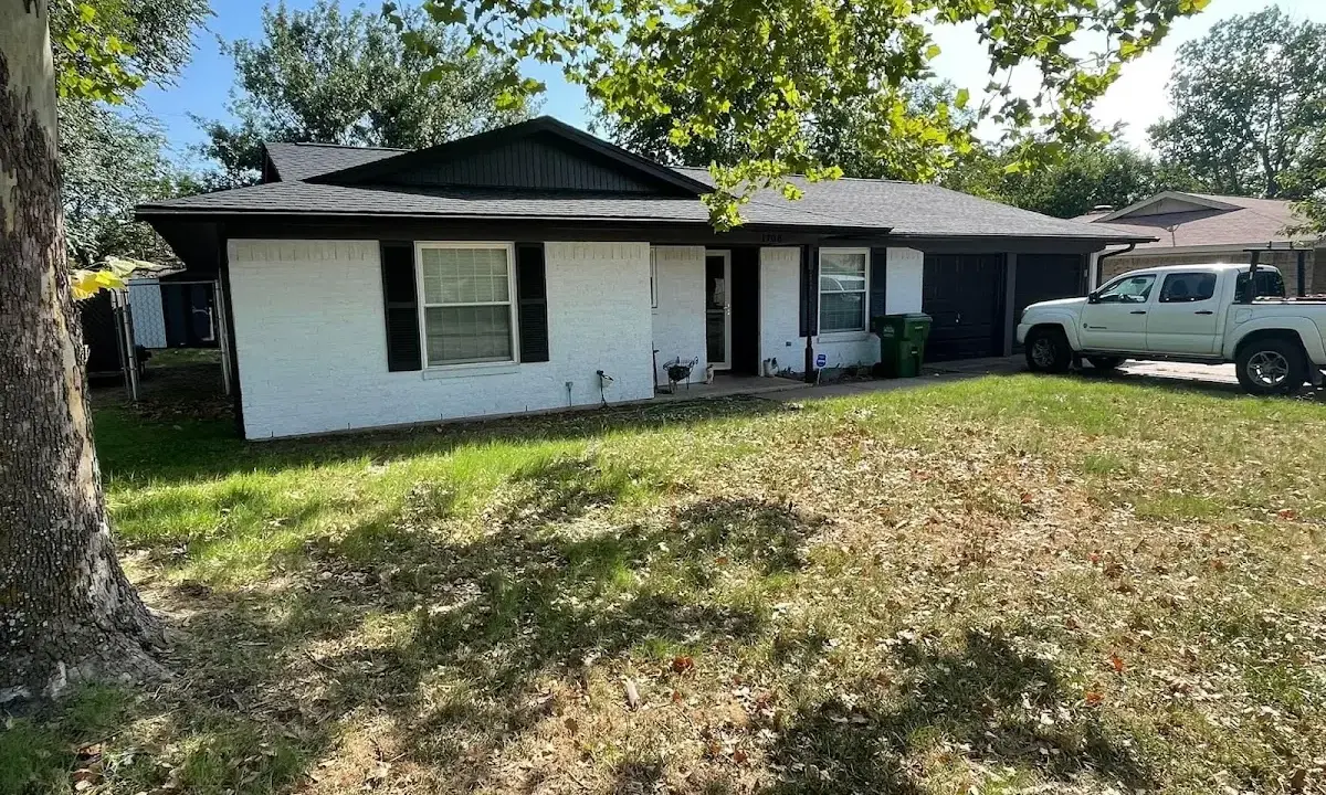 Professional roofing crew working on a residential roof in Columbia